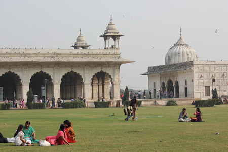 DELHI, INDIA: Indian people relaxing on the grass inside the Red Fort Complex in Delhi, Indiaのeditorial素材