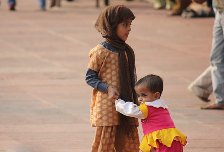 DELHI, INDIA: Child in Delhi, India, an image of poverty in modern age. Image taken outside the Red Fortのeditorial素材