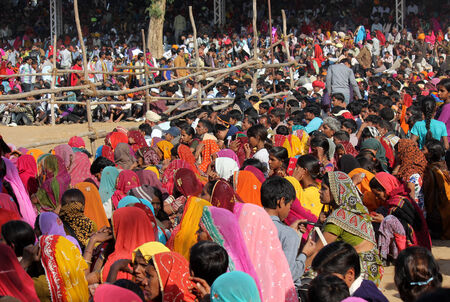 Pushkar, India: Crowd of people at Pushkar fair, in the Indian Rajasthan state, waiting for an exhibitionのeditorial素材
