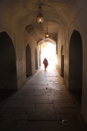 JAIPUR, INDIA: Architectural detail of the internal corridor of Amber Fort, the main touristic attraction in Jaipur, with an Indian woman in the backgroundのeditorial素材