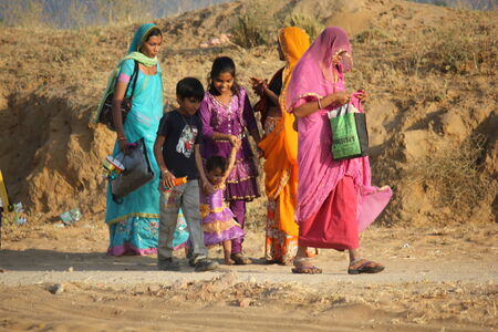 PUSHKAR, INDIA: Indian family walking for going to Pushkar Fair, in the Rajasthan desert state of Indiaのeditorial素材