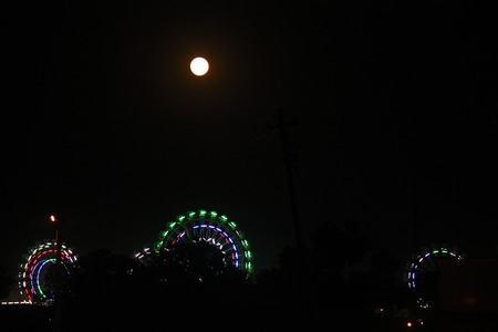 PUSHKAR, INDIA - NOV 28: Pushkar fair at night. Night View of the Ferris wheel illuminated in the dark skyのeditorial素材