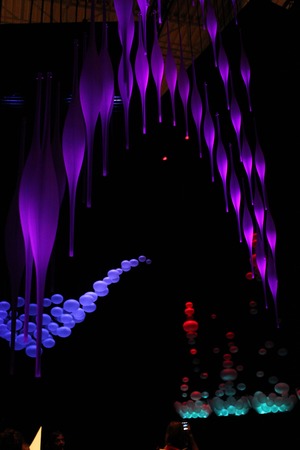 MILAN, ITALY - APR 8: Light installation during the Milan Design Week, with beautiful colore effect on a black background, on April 8 2014のeditorial素材