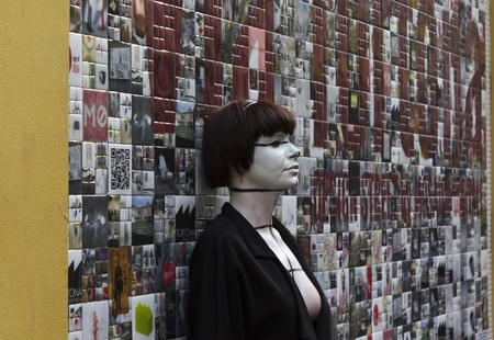 MILAN, ITALY - APR 8: Beautiful Wall Art in Milan in Via Tortona, with a girl standing on the wall, during the Fuorisalone on April 8 2014のeditorial素材