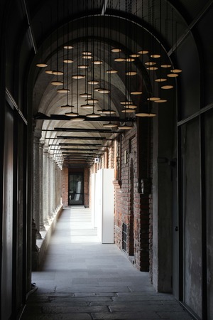 MILAN, ITALY - APR 8: University of Milan indoor corridor during the Milan Furniture fair on April 8 2014, with design design lamp on the ceilingのeditorial素材