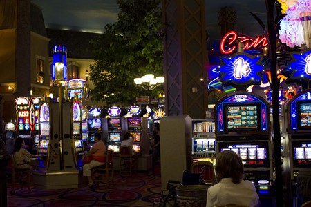 LAS VEGAS, AUGUST 5 2013: People playing at Slot Machines at night in a Casino in Las Vegas, Nevadaのeditorial素材