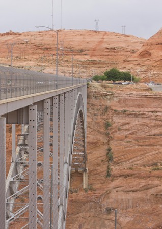 ARIZONA, USA - AUG 6  2013: Iron bridge on the street to Grand Canyon National Park in Usa, surrounded by a desert red rock natureの写真素材