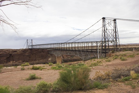 ARIZONA, USA - AUG 7 2013: Old iron bridge on the road to Grand Canyon National Park, isolated in the desertの写真素材