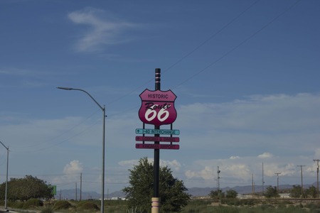 ARIZONA, USA - AUGUST 8 2013: Historic Route 66 pink road sign on the highway, with nobody aroundのeditorial素材