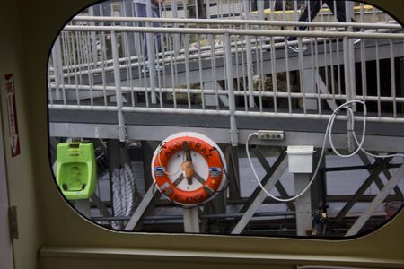ALCATRAZ, USA - AUGUST 12 2013: Arriving in Alcatraz Penitentiary. Orande lifebuoy at the pierのeditorial素材
