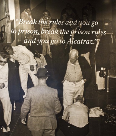 ALCATRAZ, USA - AUGUST 12 2013: Close up of a board inside the main prison, a huge board reads: âBreak the rules and you go to prison, break the prison rules and you go to Alcatraz.のeditorial素材