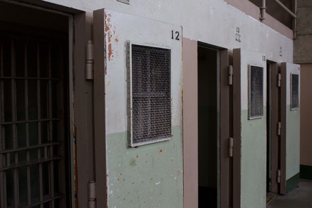 ALCATRAZ, USA - AUGUST 12 2013: Prison Corridor inside the Alcatraz Penitentiary, with the row of roomsのeditorial素材