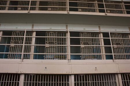 ALCATRAZ, USA - AUGUST 12 2013: Prison Corridor inside the Alcatraz Penitentiary, with the row of roomsのeditorial素材