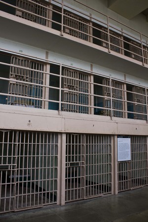 ALCATRAZ, USA - AUGUST 12 2013: Prison Corridor inside the Alcatraz Penitentiary, with the row of roomsのeditorial素材