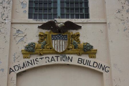 ALCATRAZ, USA - AUGUST 12 2013: Close up detail of a text for the administration building in Alcatraz, ruined by the timeのeditorial素材
