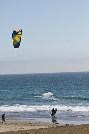 CALIFORNIA, USA - AUG 14 2013: Kite Surfing in the Pacific Ocean, on California coastline in a sunny day in the summerのeditorial素材