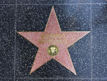 LOS ANGELES, USA - AUG 17 2013: Hollywood Walk of Fame, Bernardo Bertolucci star on the floorのeditorial素材