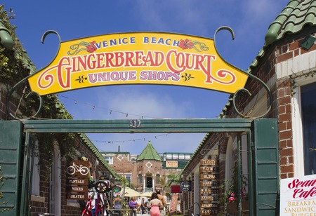VENICE BEACH, USA - AUG 17 2013: Way in to Gingerbread Court of shops just outside Venice Beach in Californiaのeditorial素材