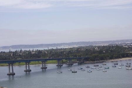 SAN DIEGO, USA - AUGUST 19 2013: View of Coronado island from Coronado bridge, with boats on the seaのeditorial素材