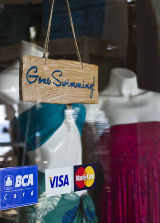 GILI ISLANDS, INDONESIA - JULY 11 2012: Closed beachwear shop with the message Gone Swimming