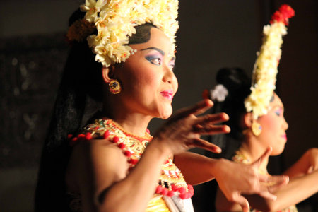 BALI, INDONESIA - JULY 6 2012: Balinese traditional dance performance, with women dancing on the stageのeditorial素材