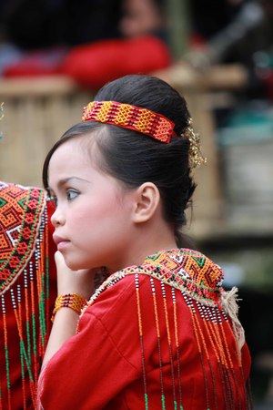 TANA TORAJA, INDONESIA - JULY 3 2012: Portrait of a beautiful Torajan child during a funeral ceremony indonesiaのeditorial素材