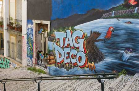 LISBON, PORTUGAL - OCTOBER 25 2014: Graffiti on Calcada do Lavra street in Lisbon, Portugal, along a stairwayのeditorial素材