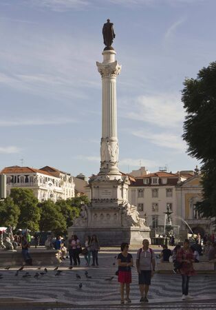 LISBON, PORTUGAL - OCTOBER 23 2014: Pedro IV column in Rossio Square in Lisbon, with people aroundのeditorial素材