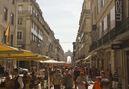 LISBON, PORTUGAL - OCTOBER 26 2014: Rua Augusta in Lisbon, full of people after the end of the marathon (orange skirts)のeditorial素材
