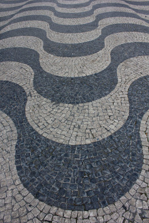 Wave cobblestone artistic pavement in Rossio Square in Lisbon, close upのeditorial素材