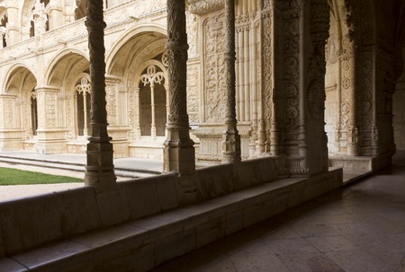 LISBON, PORTUGAL - OCTOBER 24 2014: Hallway of Jeronimos Monastery in Lisbon, facing the arched doorways of the inner Cloisterのeditorial素材