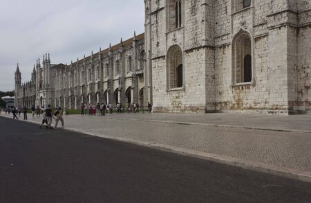 LISBON, PORTUGAL - OCTOBER 24 2014: external view of Jeronimos Monastery in Lisbon, Portugal, facing the street with people aroundのeditorial素材