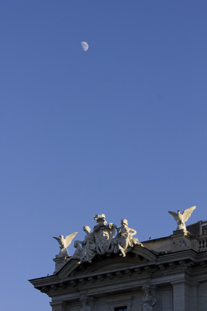 ROME, ITALY - DECEMBER 30 2014: Rooftop of Piazza della Repubblica in Rome with angels statue and the moonのeditorial素材