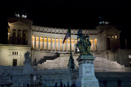 ROME, ITALY - DECEMBER 30 2014: The Altar of the Fatherland, also known as National Monument to Victor Emmanuel II, lighted at night in Rome, with its equestrian statue in the middleのeditorial素材