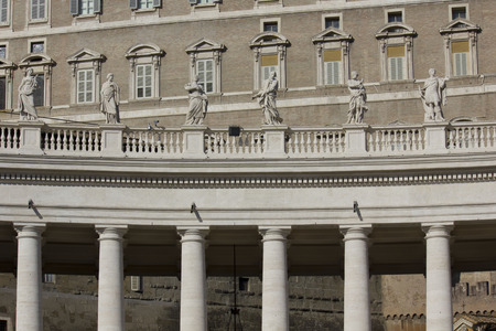 ROME, ITALY - DECEMBER 31 2014: Architectural close up of the colonnade in Saint Peters Square in Vatican City, with statues on the terraceのeditorial素材