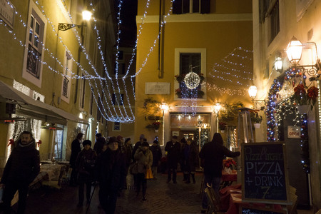 ROME, ITALY - DECEMBER 30 2014: People at night in Via delle Paste in Rome, lighted for holidaysのeditorial素材