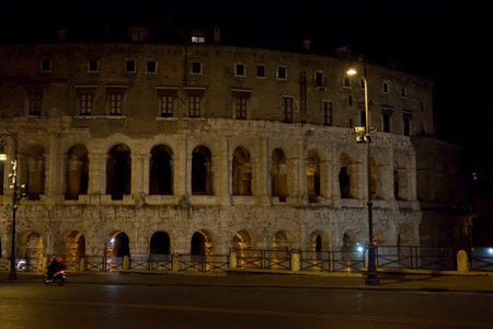 ROME, ITALY - DECEMBER 30 2014: The Theatre of Marcellus ( Italian: Teatro di Marcello)  ancient building at night in Rome, view from the streetのeditorial素材