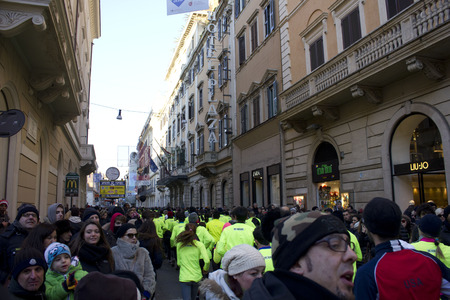 ROME, ITALY - DECEMBER 31 2014: People running the We Run Rome competition in Via del Corso in Rome, with viewer on the boarderのeditorial素材