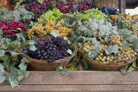 MILAN, ITALY - JUNE 29 2015: colorful various Grape false fruit on the street during the period of Expo 2015 in Milan, international exhibition dedicated to food.のeditorial素材