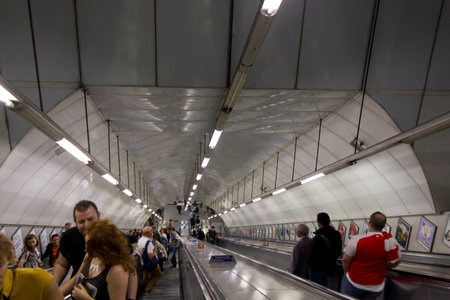 LONDON, UNITED KINGDOM - SEPTEMBER 12 2015: People on underground tunnel staircase in London.