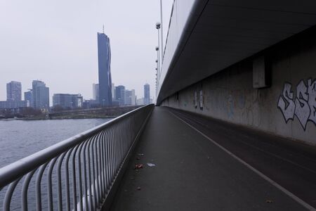 VIENNA, AUSTRIA - JANUARY 3 2016: View from the imperial bridge, Reichsbrucke, of the Danube and modern glass buildingsのeditorial素材
