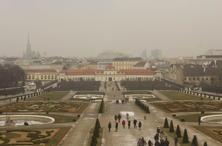 VIENNA, AUSTRIA - JANUARY 1 2016: view from the top of upper Belvedere of Lower Belvedere, its park and Vienna cityscape, in a snowy and foggy winter dayのeditorial素材