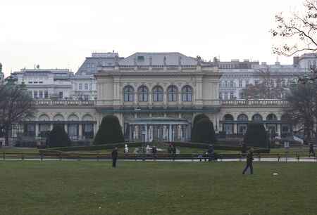 VIENNA, AUSTRIA - JANUARY 1 2016: Kursalon Building in Vienna inside Stadtpark, viennese city Park, in a foggy winter day with few people aroundのeditorial素材