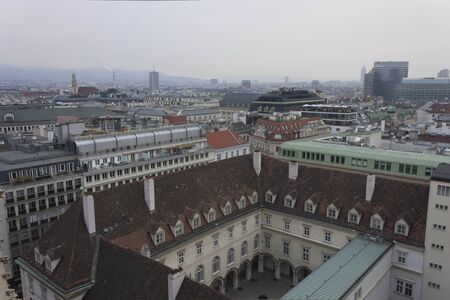 VIENNA, AUSTRIA - JANUARY 3 2016: Overview of Vienna skyline in a cloudy day, from the top of the cathedralのeditorial素材