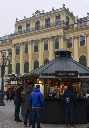 VIENNA, AUSTRIA - JANUARY 2 2016: Christmas market in the forecourt of Schonbrunn palace, with people around in day timeのeditorial素材