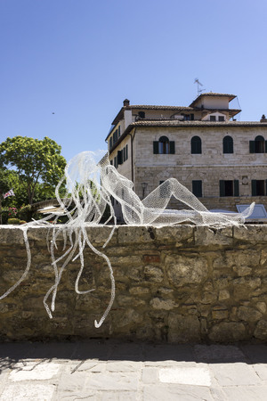 BAGNO VIGNONI, ITALY - JUNE 3 2017: Metal Wires transparent sculpture by Italian sculptress Daniela Capaccioli in Bagno Vignoni medieval town in Tuscany, Italyのeditorial素材