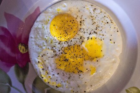 LASTRA A SIGNA, ITALY - JULY 10 2015: Close up of a fried egg with pepperのeditorial素材