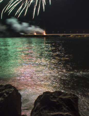 MARINA DI MASSA, ITALY - AUGUST 22 2015: Firework by the sea in Marina di Massa, Italy, from its famous pierのeditorial素材