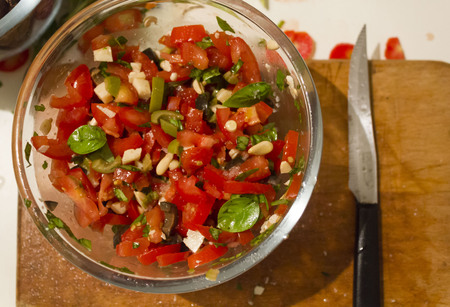 MASSA, ITALY - AUGUT 23 2015: fresh homemade sauce for pasta, vegetarian with pine nuts, tomatoes, basil and olivesのeditorial素材