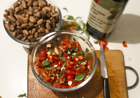 MASSA, ITALY - AUGUT 23 2015: fresh homemade sauce for pasta, vegetarian with pine nuts, tomatoes, basil and olivesのeditorial素材